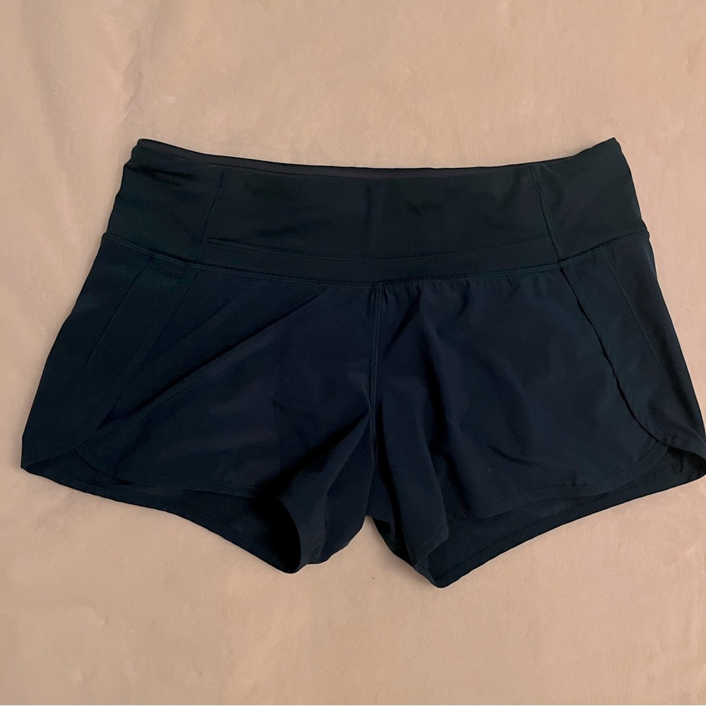 Blue lululemon running shorts zipper pocket in rear.